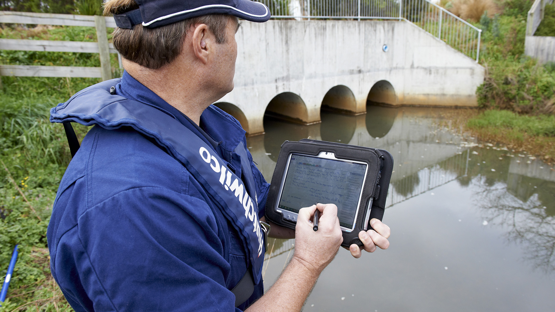 Image - incident response staff at stormwater pond