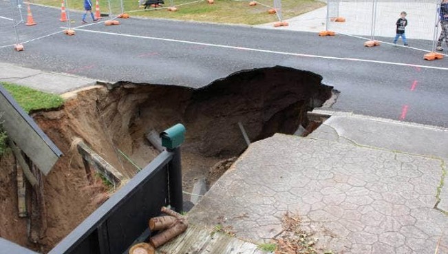 Image of a large hole in the ground from subsidence