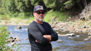 Dave Hamon standing in front of a river.