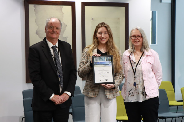 Grace Mitchell (centre) is presented with the Dr Stella Frances Scholarship by Waikato Regional Chair Russ Rimmington and Councillor Kathy White.